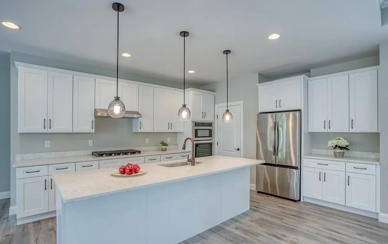 Kitchen with gas range, quartz counters and open sightlines